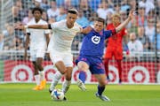 Minnesota United midfielder Will Trapp (20) and New York City midfielder Alfredo Morales (7) fought for the ball in Saturday’s game at Allianz Field