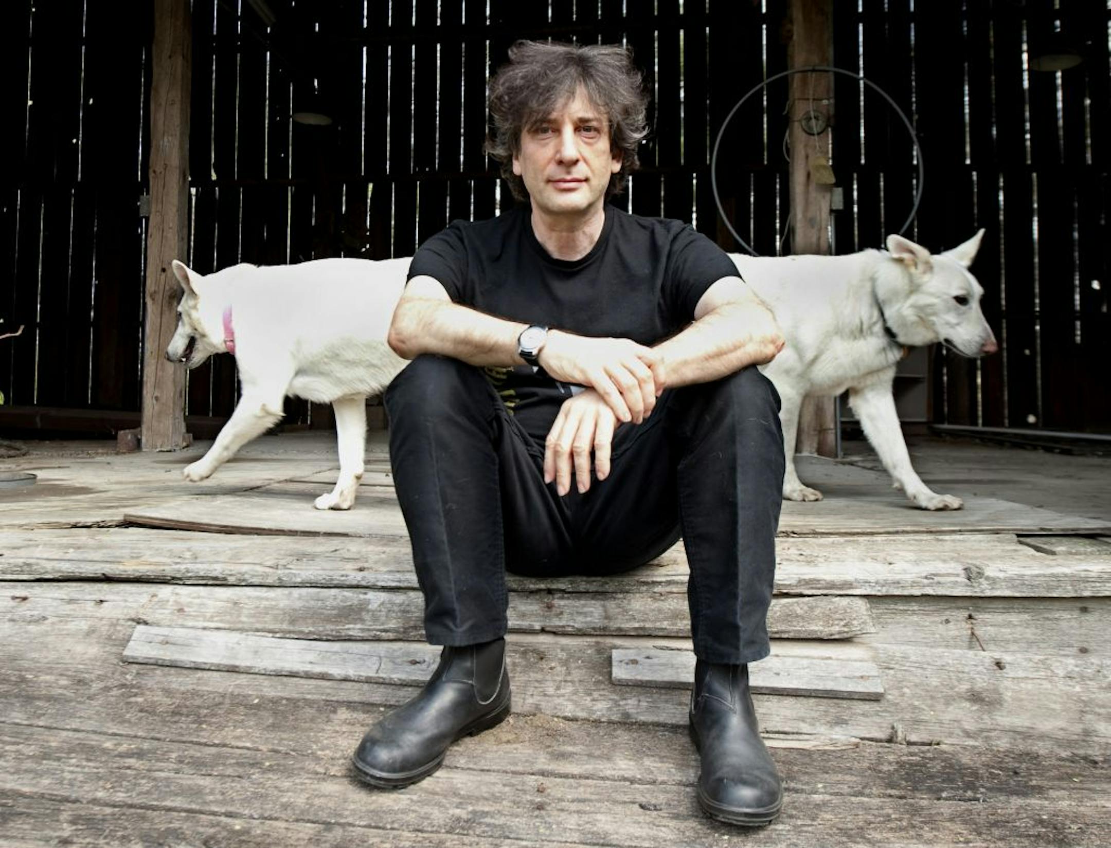 In this April 23, 2010 photo, best-selling author Neil Gaiman, 49, sits at an old barn near his writing gazebo at his home in western Wisconsin.