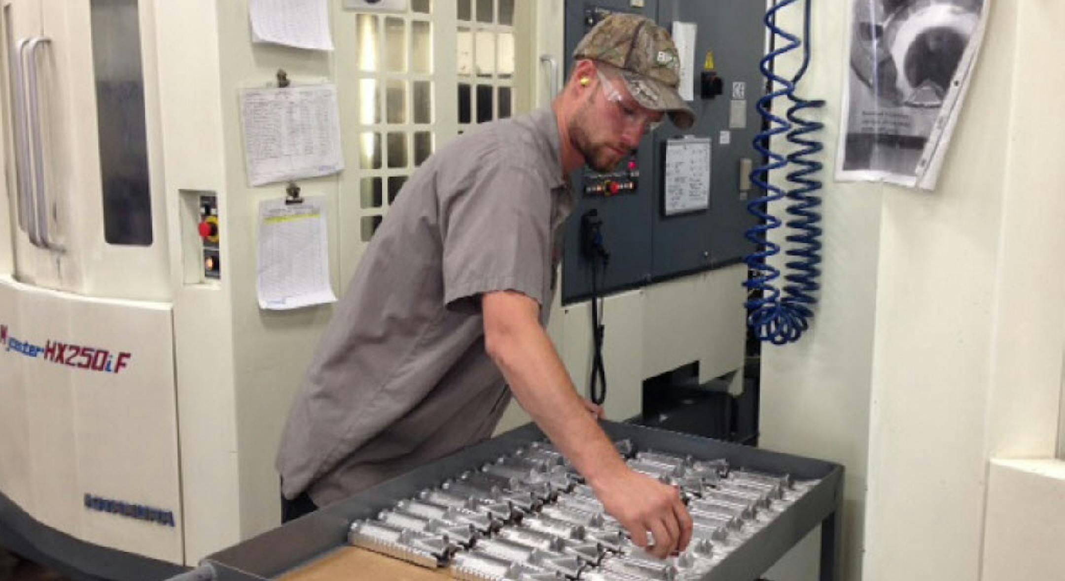 Steve Fahey prepared aluminum rifle components at Haberman Machine in Stillwater. A Small Business Administration debt refinancing loan in 2011 helped the manufacturer emerge from the downturn.