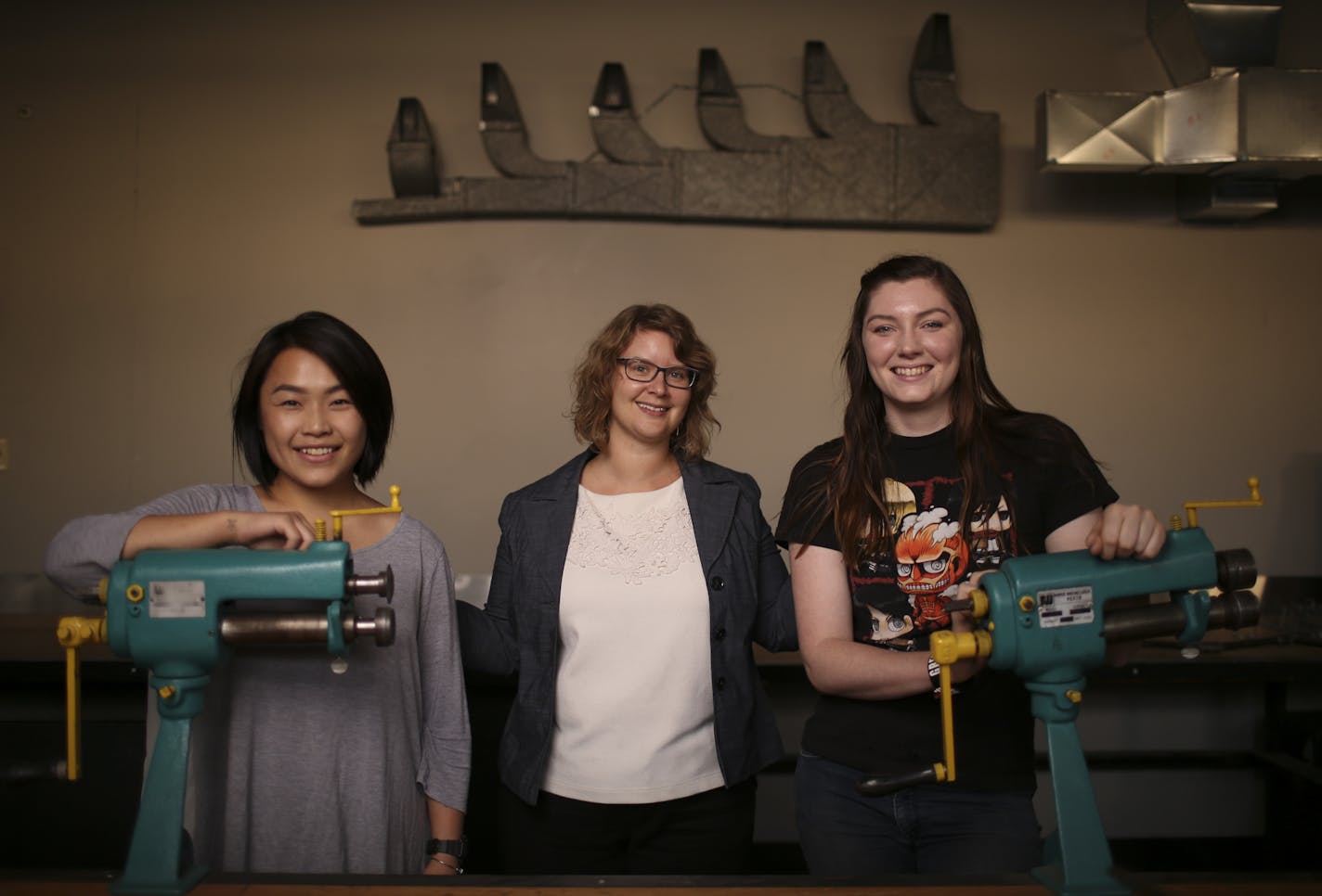 Melysia Cha, a construction management student, Maggie Whitman, Women&#xed;s Enrollment Coordinator, and Tovah Penning, an HVAC student, from left, photographed in an HVAC classroom. ] JEFF WHEELER &#xef; jeff.wheeler@startribune.com Melysia Cha, a construction management student, and Tovah Penning, an HVAC student, are among an elite and highly non-traditional cohort of low-income women pursuing associate's degrees at Dunwoody College of Technology through its Women In Technical Careers program