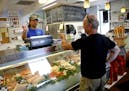 Bob LaMoure at right speaks with Coastal Seafoods Jon Vaughn as he buys Blue Marlin. LaMoure planned to grill it with mango sauce on the side.