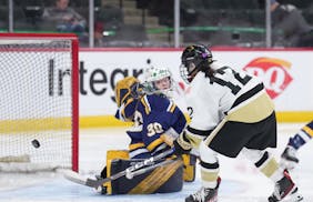 Andover forward Isa Goettl (12) scored her fourth goal of the game past Rosemount goaltender Avery Miller (30) in the third period at Xcel Energy Cent