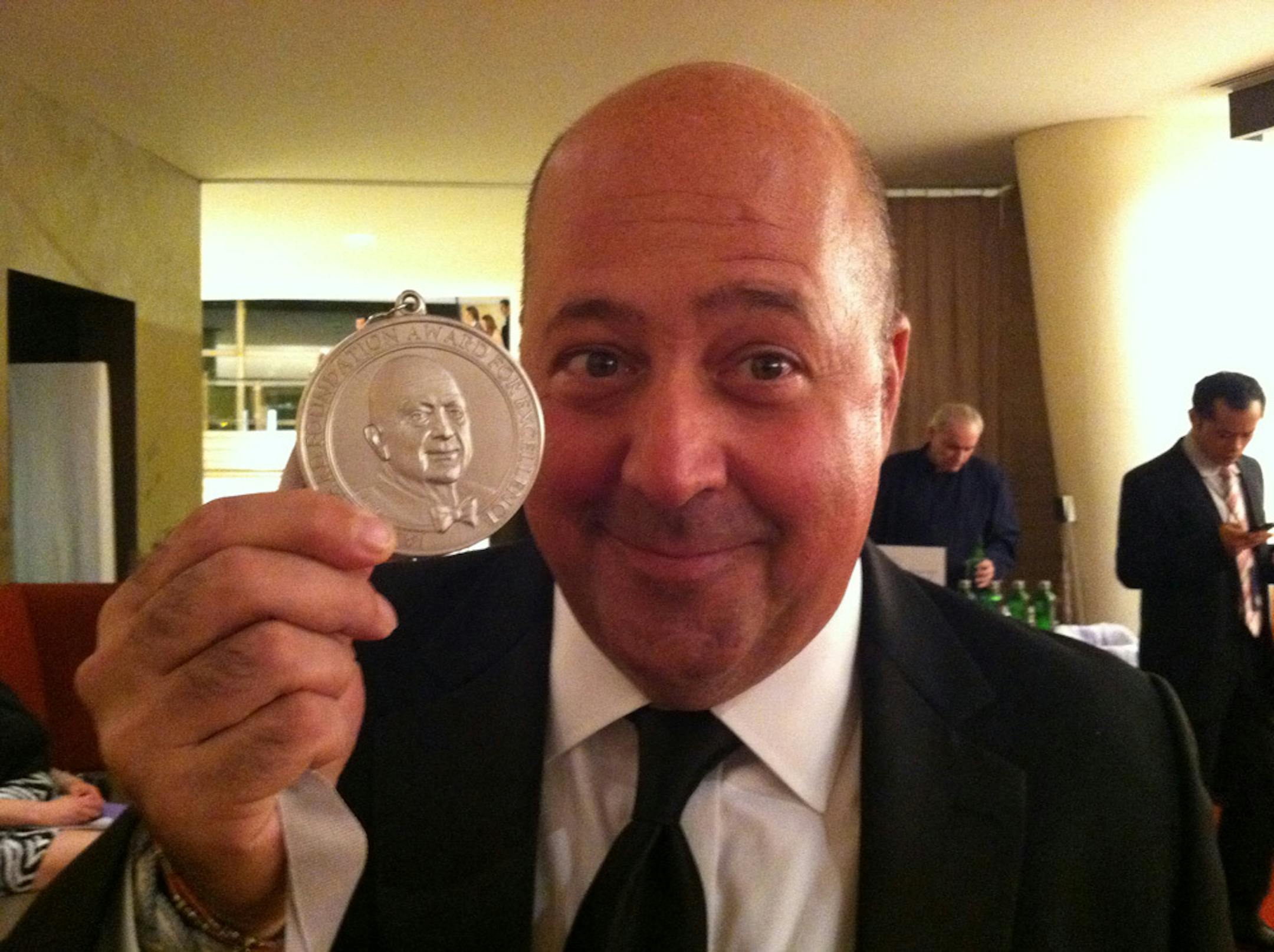 Andrew Zimmern with his James Beard Award at Monday's gala at New York City's Avery Fisher Hall.