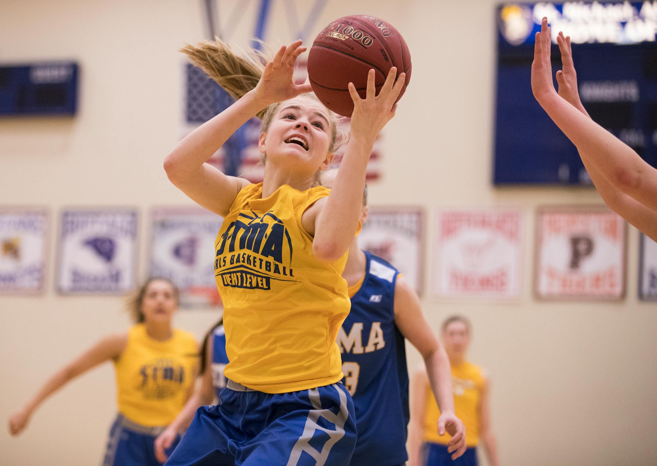 Kendal Cox, an eighth-grader with the St. Michael-Albertville varsity, grabbed a rebound during a recent practice. Her older sister, Kelsie, is a senior for Elk River.