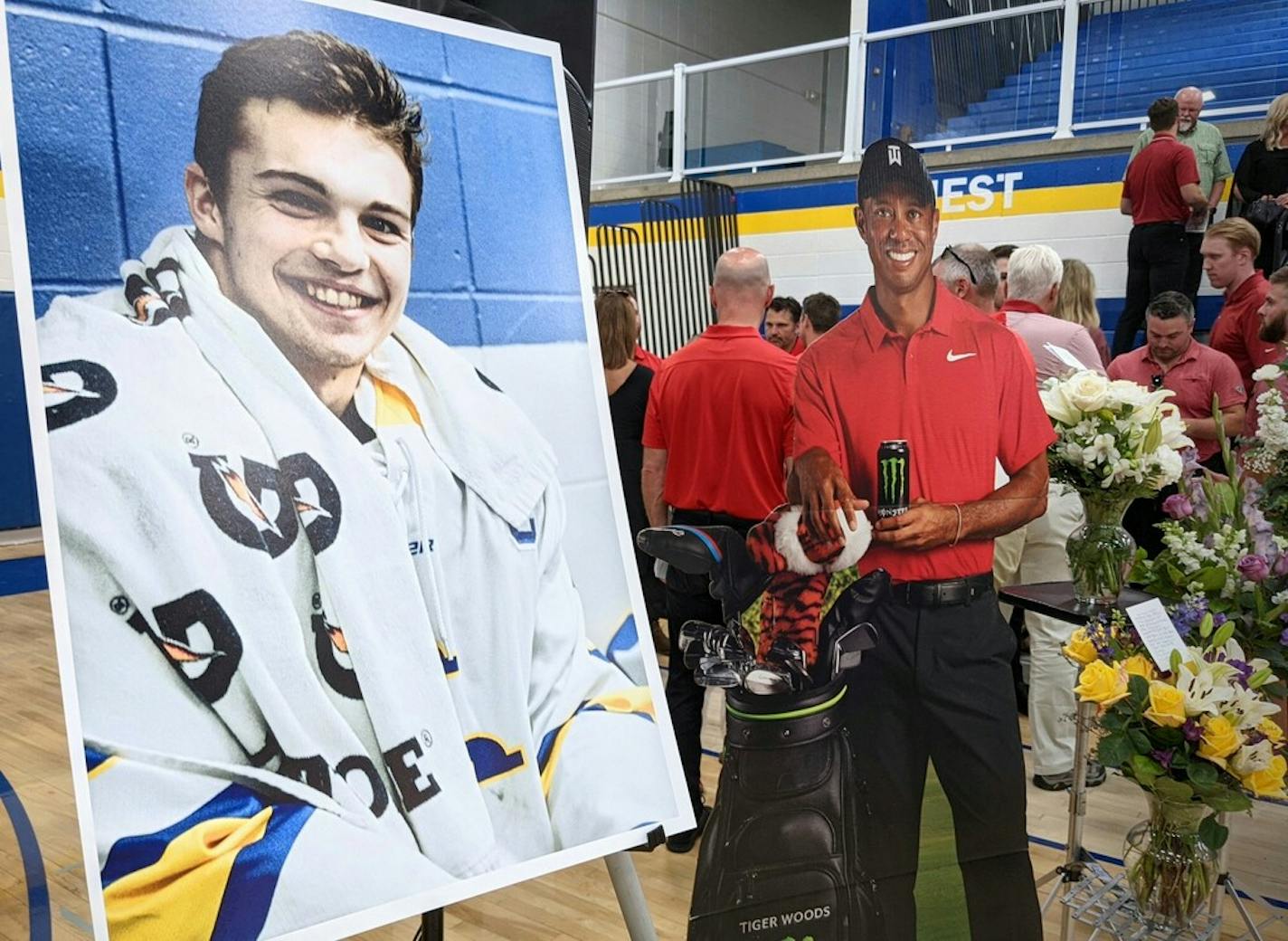 A cardboard cutout of Tiger Woods stood beside Mack Motzko's picture at his celebration of life ceremony Monday, Aug. 2, 2021 in St. Cloud. The family asked attendees to wear a "Sunday red" golf shirt in honor of Mack's love of golf and Woods. (Credit: Jenny Berg)