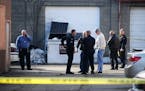 The Kenosha Police Department investigates a scene in Kenosha, Wis., on Saturday, March 14, 2015 after an officer shot and killed a suspect during a c