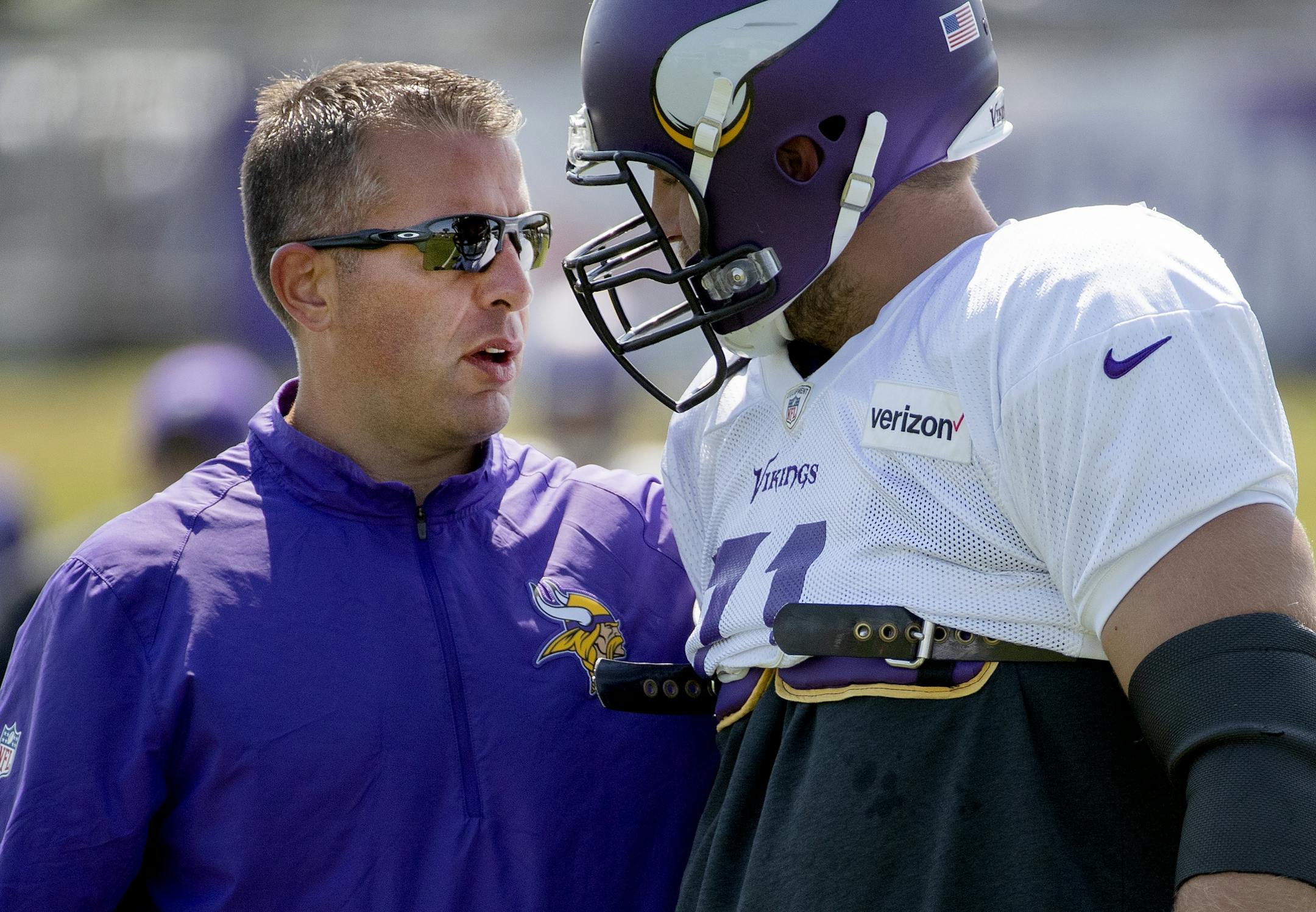 Minnesota Vikings offensive coordinator John Defilippo spoke with Riley Reiff (71).