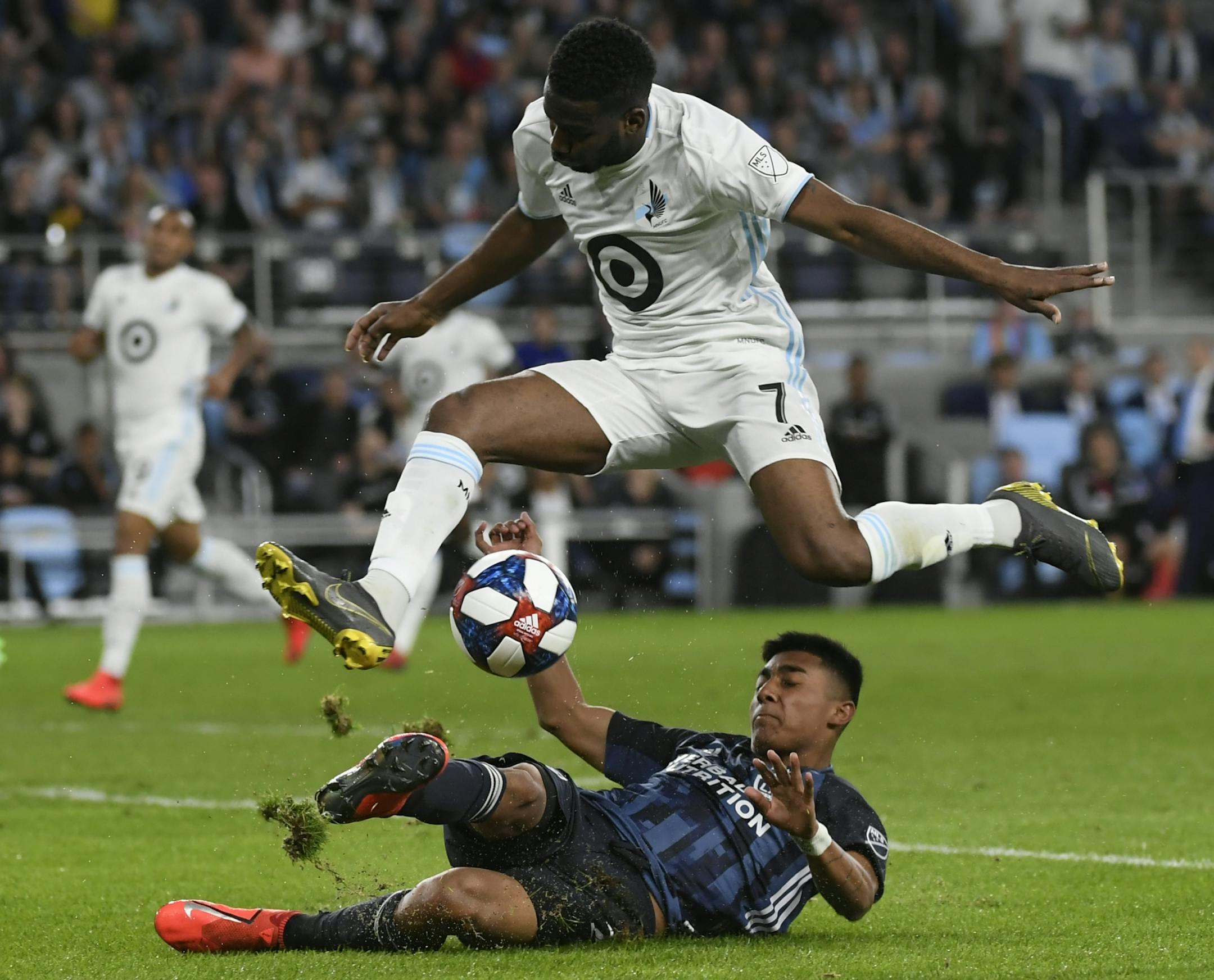 Minnesota United midfielder Kevin Molino (7) hopped over Los Angeles Galaxy defender Julian Araujo (22) in the second half.