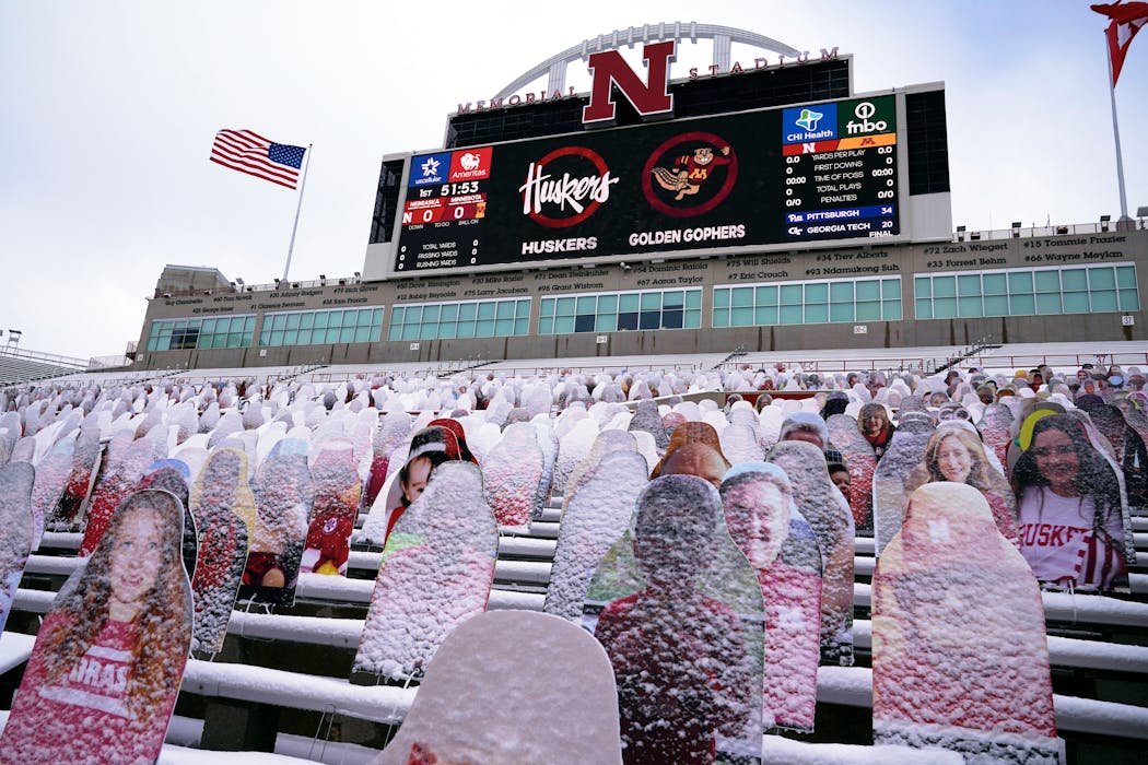 Snow-covered cutouts of fans replaced real ones during the 2020 game between the Gophers and Cornhuskers in Lincoln.