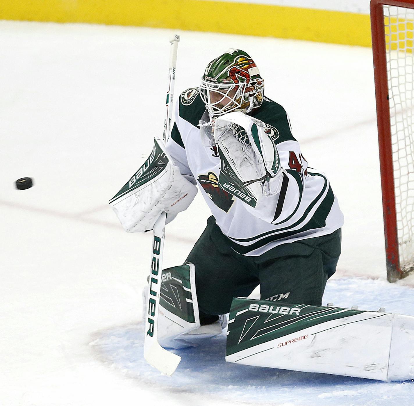 A first-period shot by the Anaheim Ducks' Shea Theodore, not pictured, makes its way past Minnesota Wild goalie Devan Dubnyk at the Honda Center in Anaheim, Calif., on Wednesday, Jan. 20, 2016. (Rick Loomis/Los Angeles Times/TNS) ORG XMIT: 1179673 ORG XMIT: MIN1601210001380137