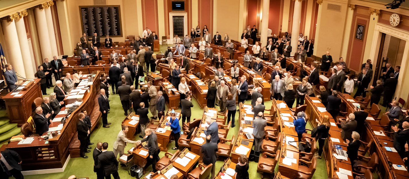 Members stood as the Senate members entered the House Chamber for the vote on an new U of M regent.