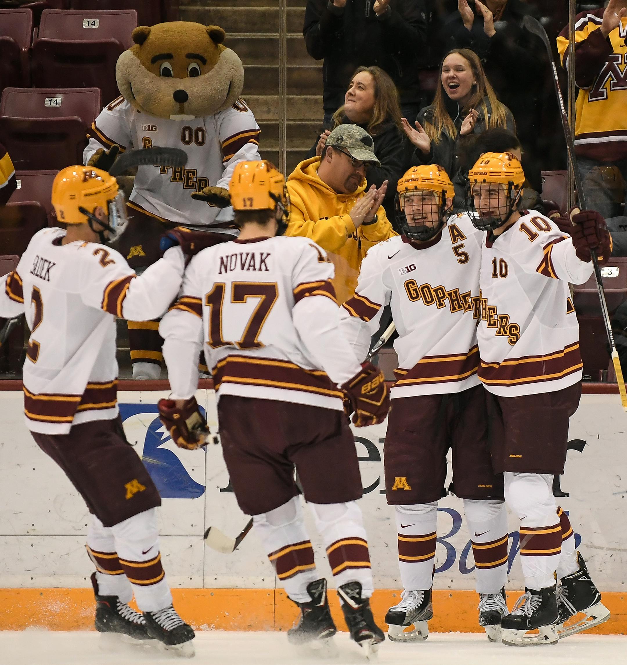 Teammates celebrated with Minnesota Golden Gophers forward Brent Gates Jr. (10) after Novak scored a goal in the first period Friday against the Harvard Crimson. ] AARON LAVINSKY &#xef; aaron.lavinsky@startribune.com The University of Minnesota Golden Gophers men's hockey team played the Harvard Crimson on Friday, Nov. 17, 2017 at the 3M Arena at Mariucci in Minneapolis, Minn.