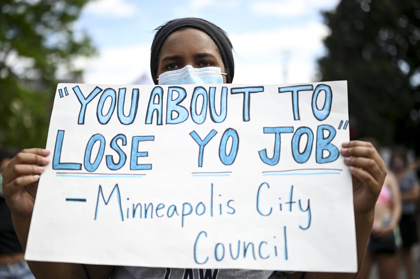 Recent U of M graduate Emma Dozier protested against police brutality. ] aaron.lavinsky@startribune.com Protesters took part in a "Bob KKKroll Must Go!" rally against the Minneapolis Police Union and its president outside the union headquarters on Friday, June 12, 2020 in MInneapolis, Minn.