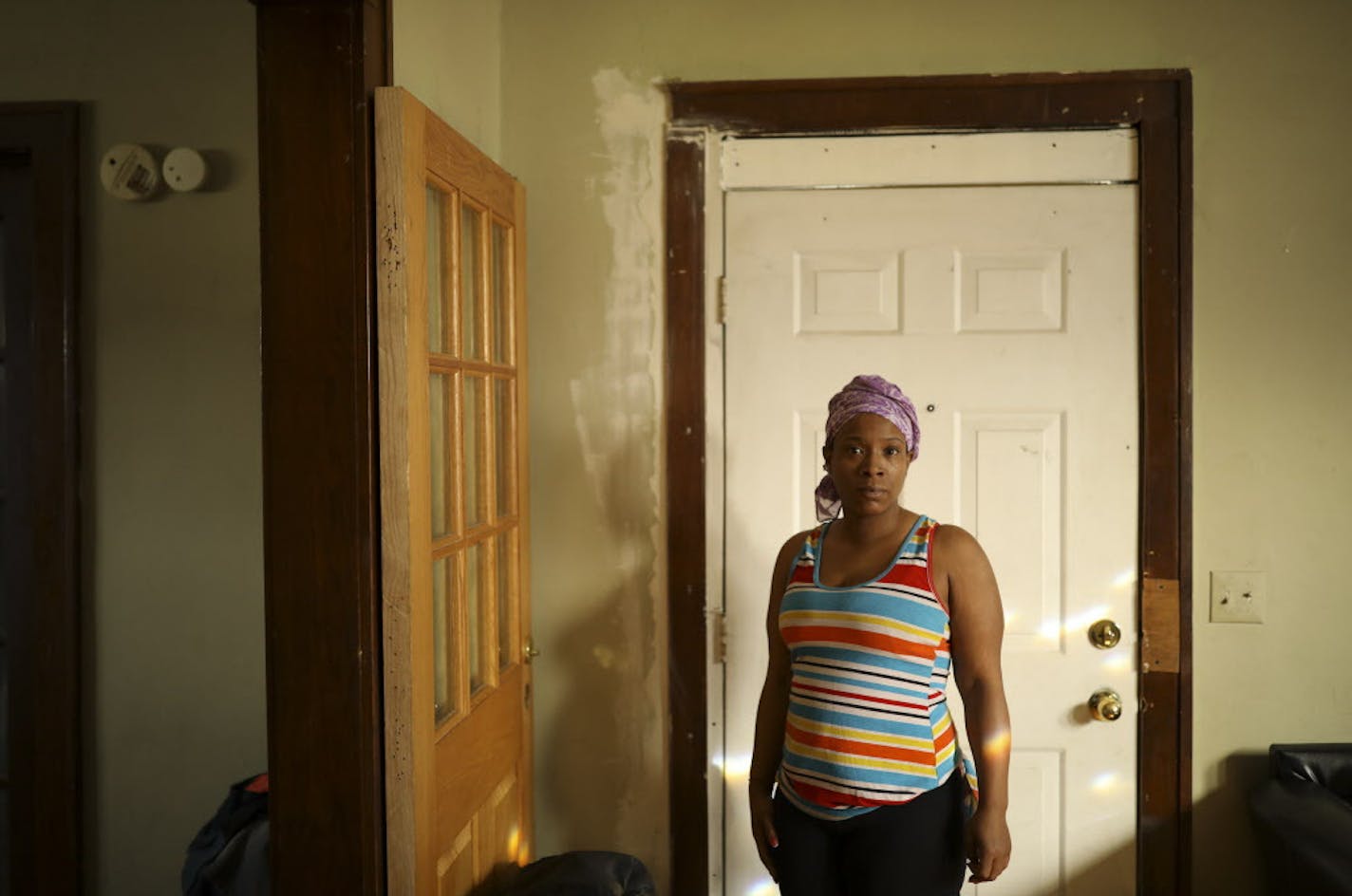 Candice Vance had a new door installed, but it was shorter than the old door, so a 2-by-4 was nailed onto the top of the door frame as a stopgap.