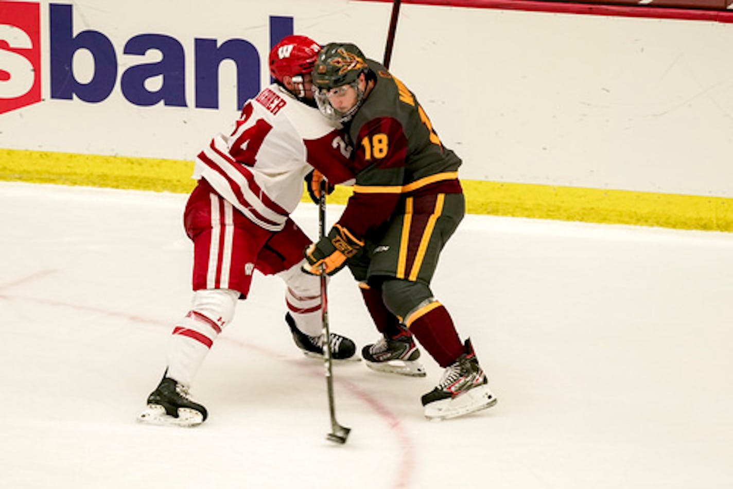 Wisconsin's Anthony Kehrer (24) and Arizona State's Jax Murray (18) during the second period of an NCAA college hockey game Saturday, Nov. 28, 2020, in Madison, Wis. (AP Photo/Andy Manis)