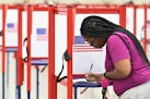 A voter fills out her ballot during the Kentucky Primary at the Kentucky Exposition Center in Louisville, Ky., Tuesday, June 23, 2020. (AP Photo/Timot