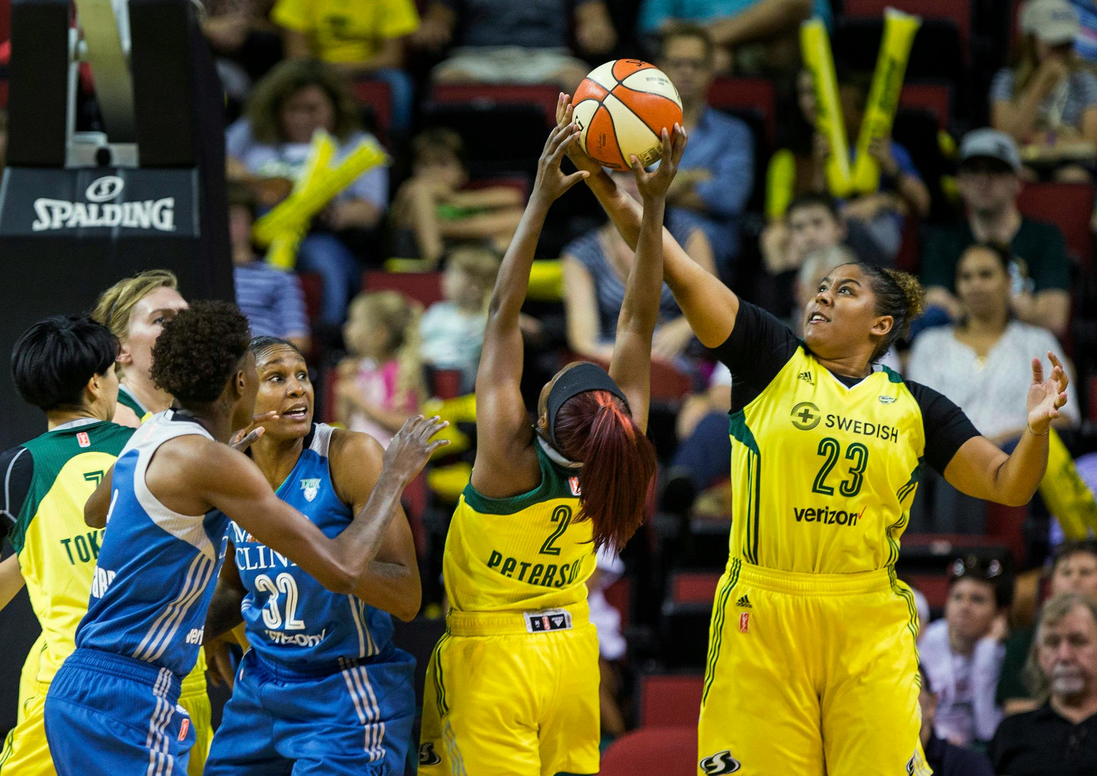Seattle Storm forward Kaleena Mosqueda-Lewis (23) and guard Alexis Patterson (2) come up with the defensive board against the Minnesota Lynx during the first half of a WNBA basketball game Wednesday, Aug. 16, 2017, in Seattle. (Dean Rutz/The Seattle Times via AP)