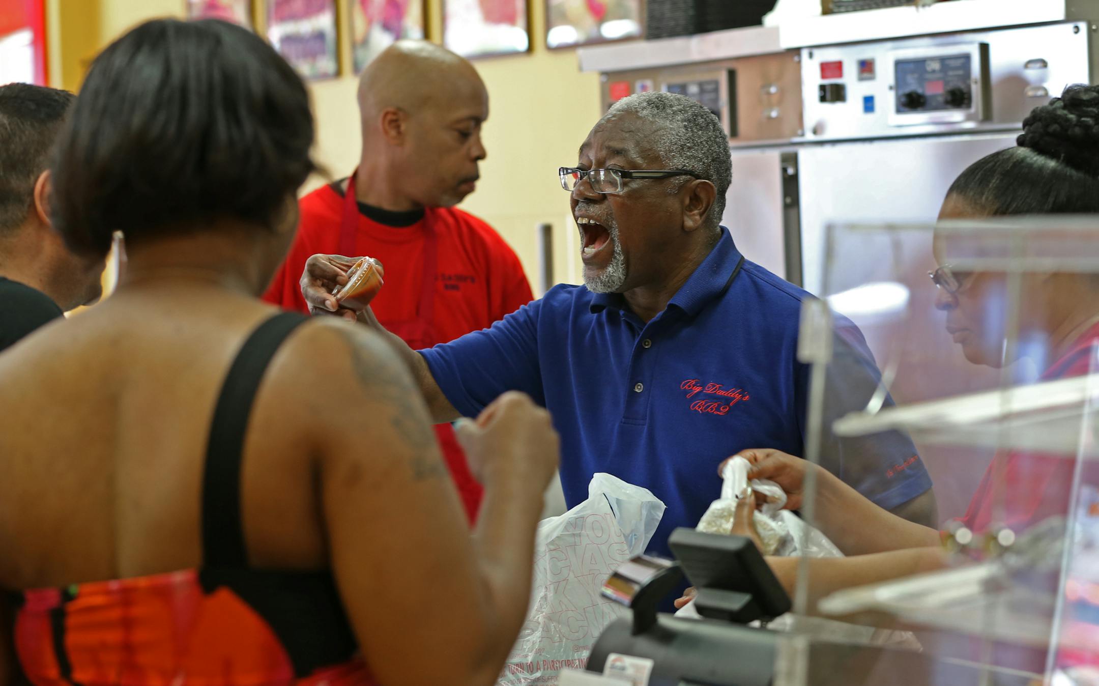 Ron Whyte whooped as he dealt with a long line of customers at Big Daddy’s Barbeque, which survived light-rail construction and expanded.