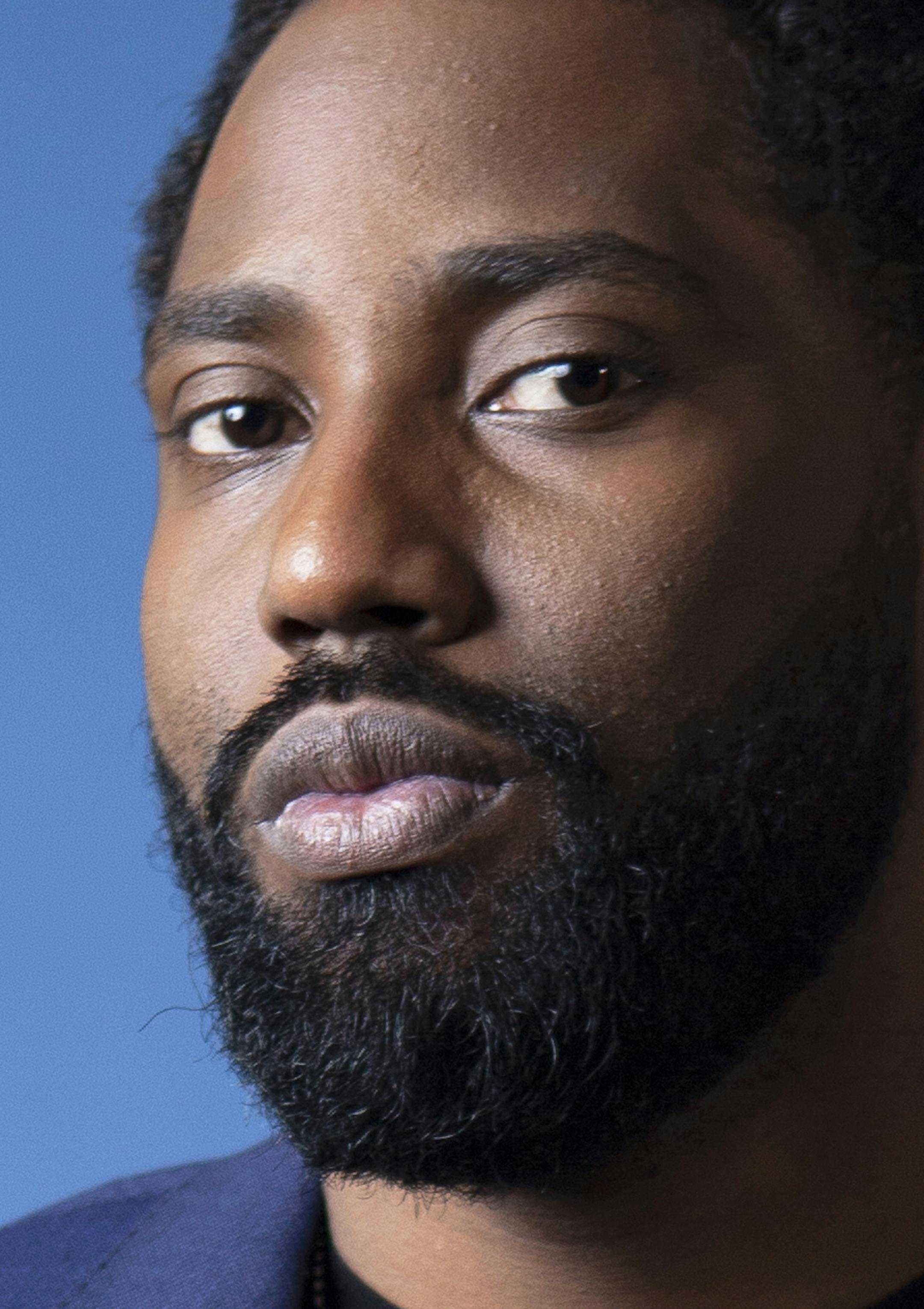 FILE - In this Nov. 14, 2018 photo, actor John David Washington poses for a portrait at the Four Seasons Hotel in Los Angeles. Washington stars in the Christopher Nolan film "Tenet." (Photo by Rebecca Cabage/Invision/AP, File)