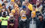 Minnesota fans braved the cold and snow during the game against Ohio State, Saturday, November 15, 2014.