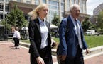 Paul Manafort's former bookkeeper Heather Washkuhn, left, walks to the Alexandria Federal Courthouse in Alexandria, Va., Thursday, Aug. 2, 2018, to te