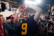 Michigan quarterback J.J. McCarthy (9) celebrates after a win over Alabama in the Rose Bowl CFP NCAA semifinal college football game Monday, Jan. 1, 2