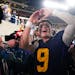 Michigan quarterback J.J. McCarthy (9) celebrates after a win over Alabama in the Rose Bowl CFP NCAA semifinal college football game Monday, Jan. 1, 2