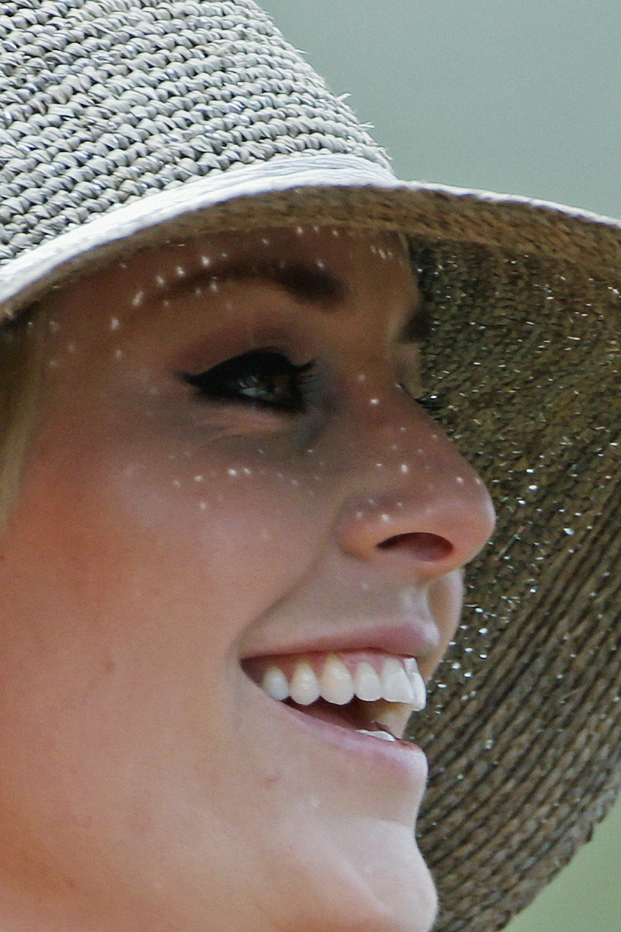 Skier Lindsey Vonn smiles as she watches Tiger Woods during the first round of the Masters golf tournament Thursday, April 11, 2013, in Augusta, Ga. (AP Photo/Darron Cummings)