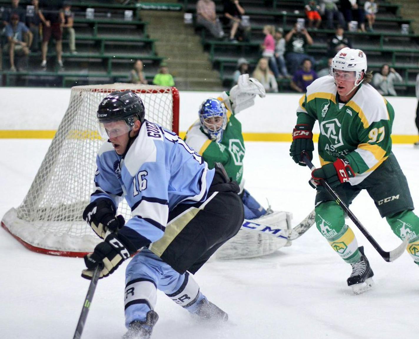 Jake Guentzel f is pursued in the corner by the Wild's Erik Haula during Da Beauty League action last season. Photo courtesy of Da Beauty League