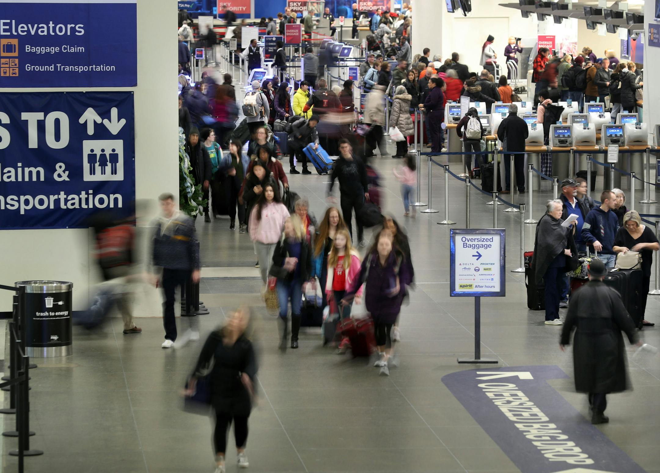 Travelers made their way through Terminal 1 at Minneapolis-St. Paul International Airport.