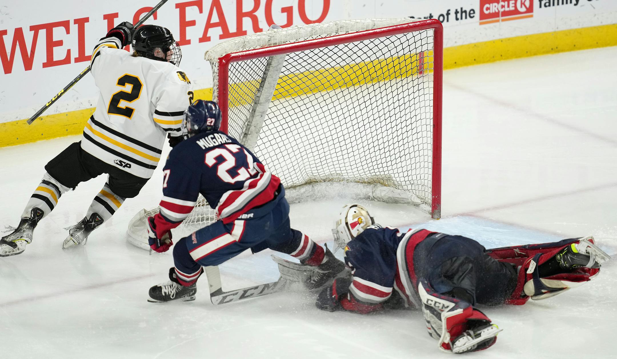 Warroad defenseman Erick Comstock (2) scores the game winning goal past Orono goaltender Brock Peyton (1) in the second period of overtime.