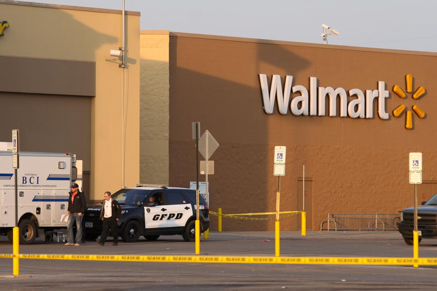 Law enforcement vehicles were outside a Wal-Mart in Grand Forks, N.D., where two people were dead after a shooting.