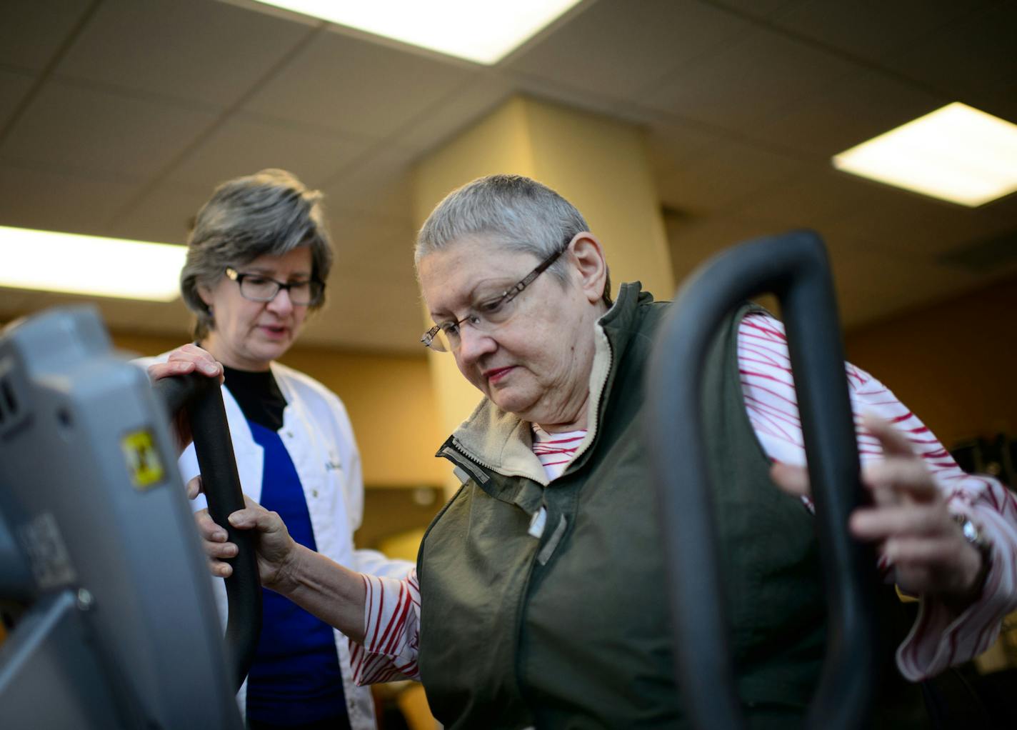 Physical therapist Martha Sullivan worked with cancer patient Jackie Fischer at Courage Kenny Institute in Minneapolis last week.