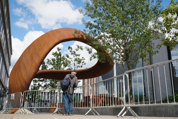 The 10-ton sculpture called "Nimbus," outside the Hennepin County Central Library in downtown Minneapolis has been fenced off for a second time this s