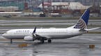 The New York City skyline gives backdrop to a United Airlines airplane taxing at Newark Liberty International Airport, Wednesday, April 12, 2017, in N