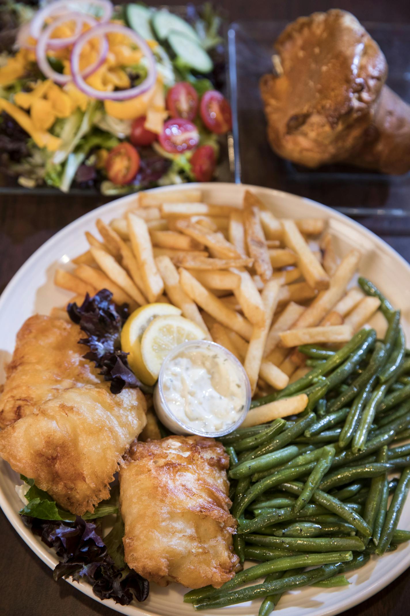 The Little Oven's fish fry dinner includes green beans, fries, salad and a popover.