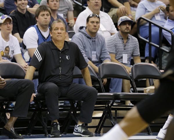 Minnesota Timberwolves head coach Flip Saunders watches his team during an NBA basketball scrimmage in Minneapolis, Wednesday, July 8, 2015.