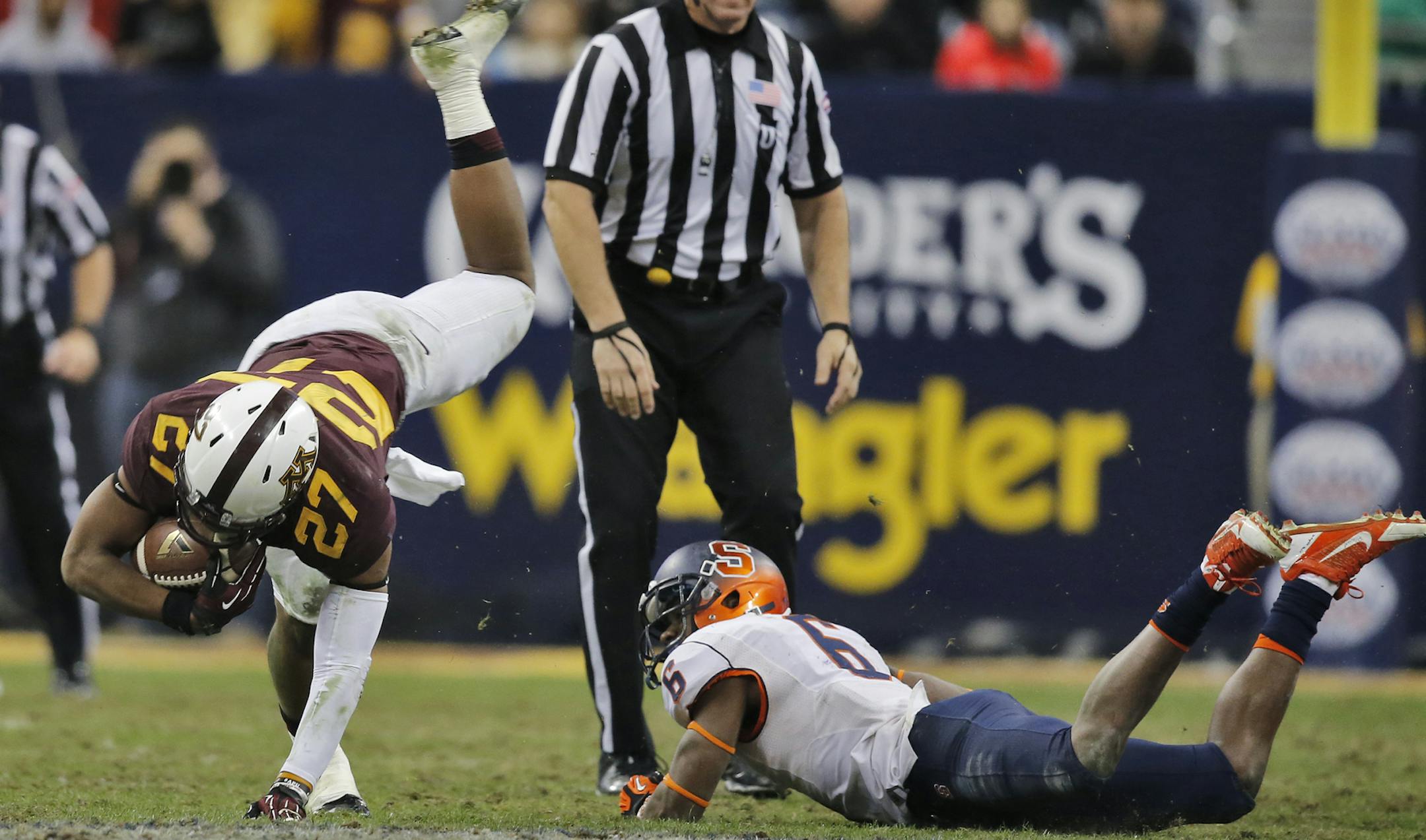Minnesota Gophers vs. Syracuse Orange in Texas Bowl. Syracuse won 21-17. Minnesota running back David Cobb (27) wiggled out some extra 2nd half yards.after being tackled. (MARLIN LEVISON/STARTRIBUNE(mlevison@startribune.com)