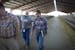 Department of Labor and Industries consultants Jim Woodfin and Hugo Valdovines walked through a barn during a consultation at a dairy farm in Sunnysid