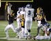 With under a minute to go Prior Lake defender Jacob Hummel, left, celebrated after picking off a pass intended for Woodbury receiver Jeremiah Coddon, 