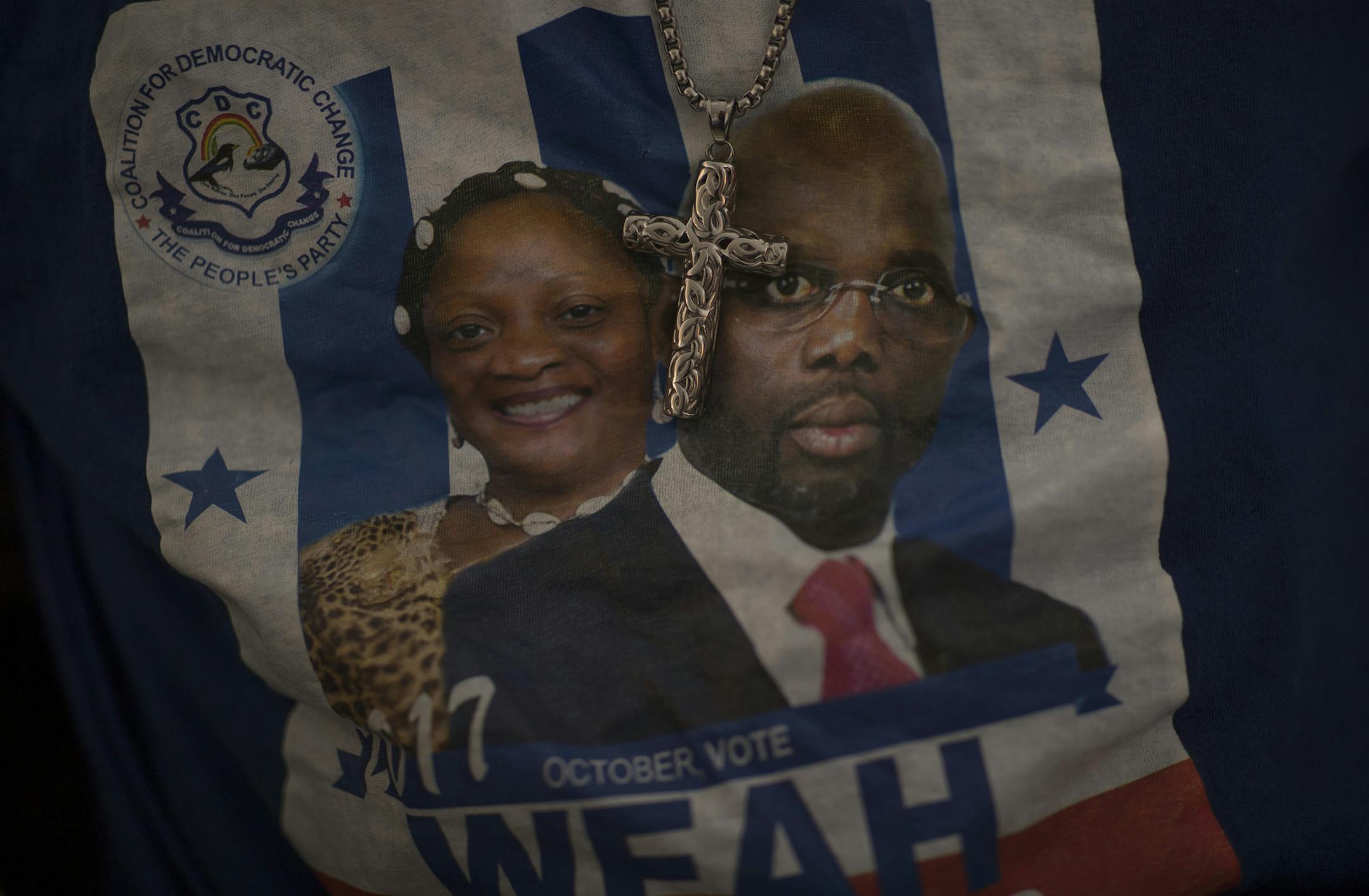 Amos Togbeson, wore a tee shirt with presidential candidates George Manneh Weah and Jewel Howard Taylor of the CDC party during live Reports from Monrovia Liberia, during a landmark presidential run-off election that is underway in Liberia Tuesday December 26, 2017 in Brooklyn Park, MN.] JERRY HOLT &#xef; jerry.holt@startribune.com