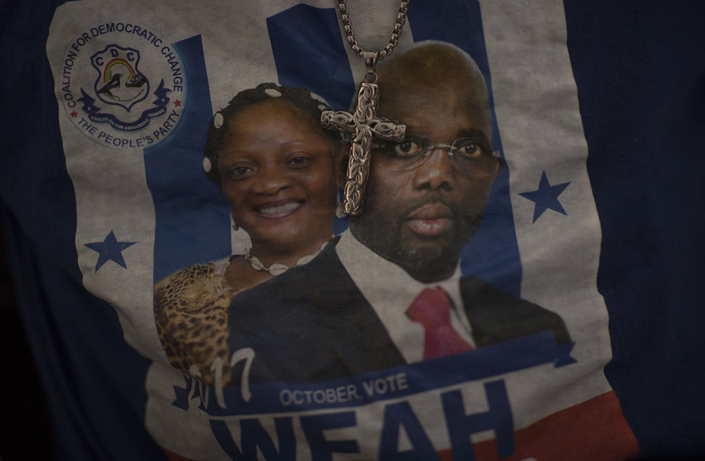 Amos Togbeson, wore a tee shirt with presidential candidates George Manneh Weah and Jewel Howard Taylor of the CDC party during live Reports from Monrovia Liberia, during a landmark presidential run-off election that is underway in Liberia Tuesday December 26, 2017 in Brooklyn Park, MN.] JERRY HOLT &#xef; jerry.holt@startribune.com