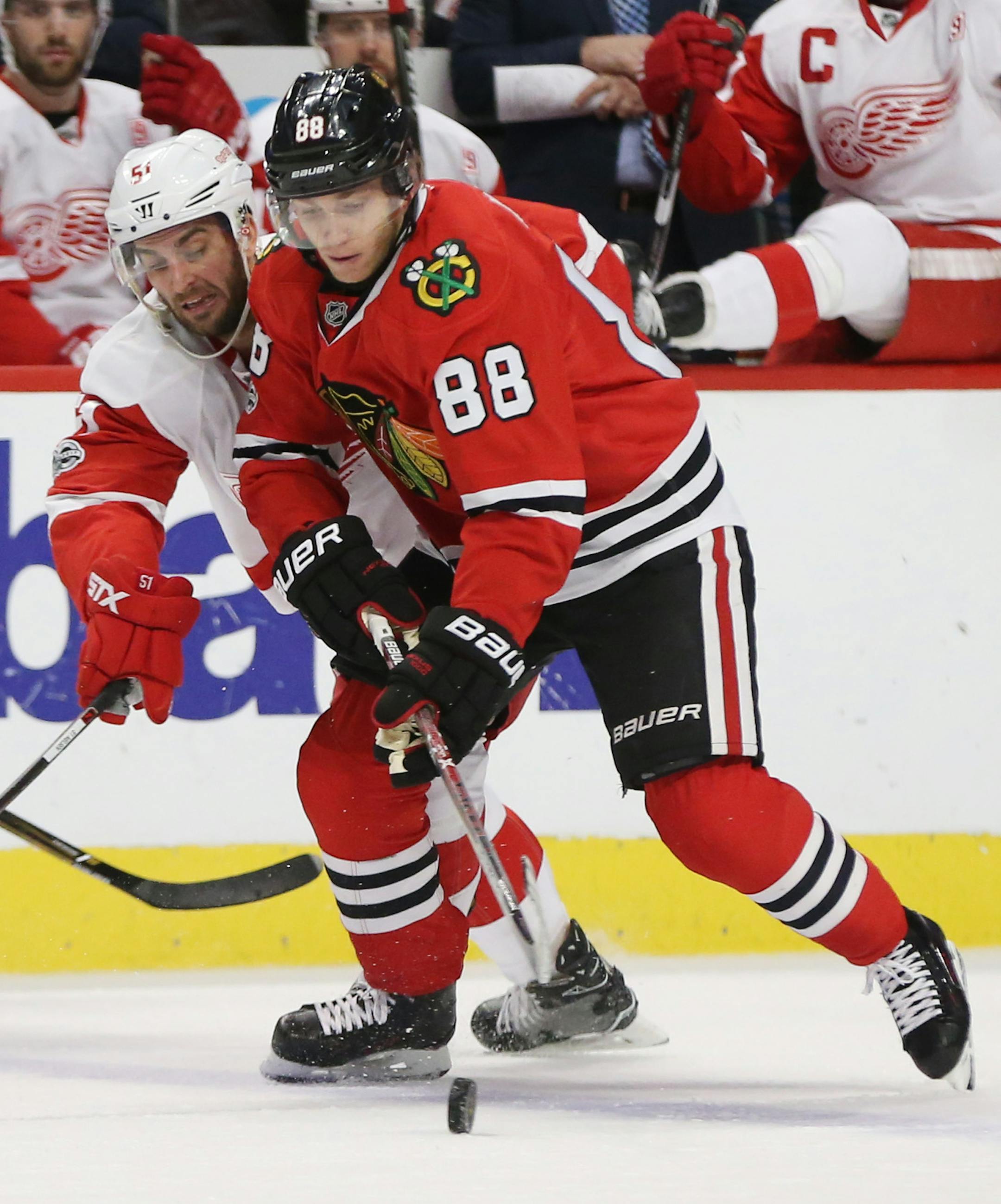 The Chicago Blackhawks' Patrick Kane (88) controls the puck in front of the Detroit Red Wings' Frans Nielsen (51) during the first period at the United Center in Chicago on Tuesday, Jan. 10, 2017. (Nuccio DiNuzzo/Chicago Tribune/TNS)