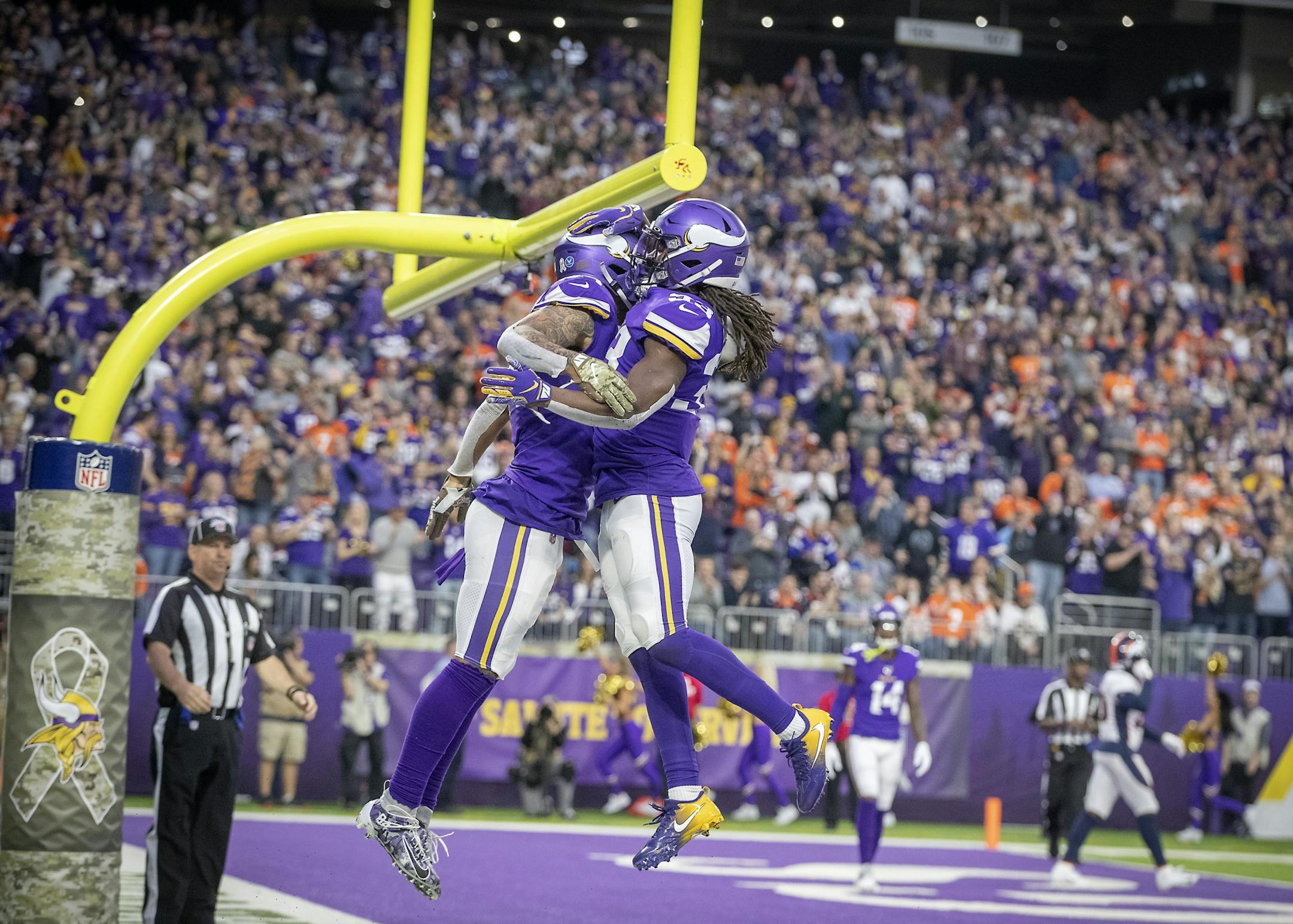 Minnesota Vikings' tight end Irv Smith, left, andrunning back Dalvin Cook celebrated his touchdown the third quarter.