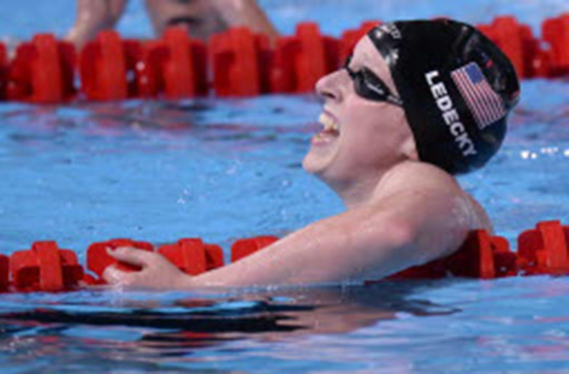 Katie Ledecky of the United States celebrates after winning the gold medal in the women's 1500m freestyle final at the FINA Swimming World Championships in Barcelona, Spain, on Tuesday. Ledecky set a new word record of 15:36.53.