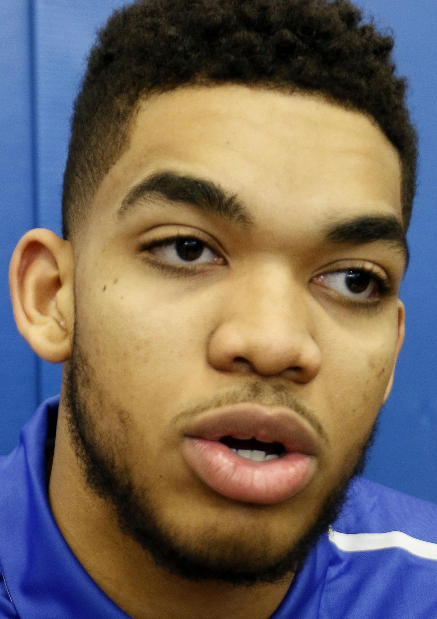 Kentucky NCAA college basketball player Karl-Anthony Towns speaks to reporters after announcing his intent to place his name in the NBA draft during a news conference at the Joe Craft Center, Thursday, April 9, 2015, in Lexington, Ky. (AP Photo/James Crisp) ORG XMIT: KYJC106