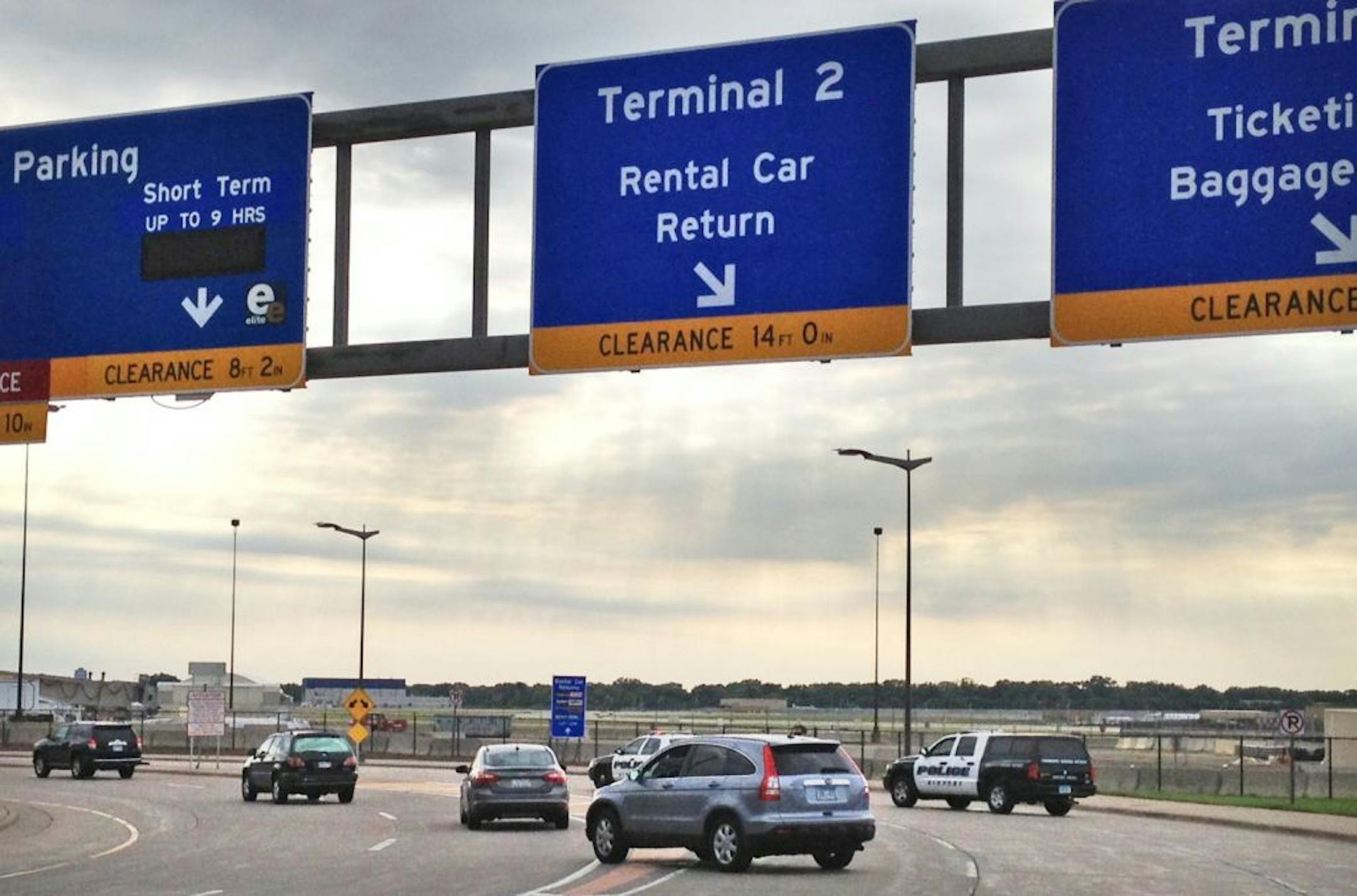 Police direct traffic away from Humphrey Terminal 2 at the MSP airport Sunday after a suspicous device was detected in luggage in the terminal.