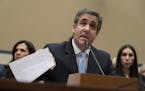 FILE - In this Wednesday, Feb. 27, 2019 file photo, Michael Cohen, President Donald Trump's former personal lawyer, reads an opening statement as he t