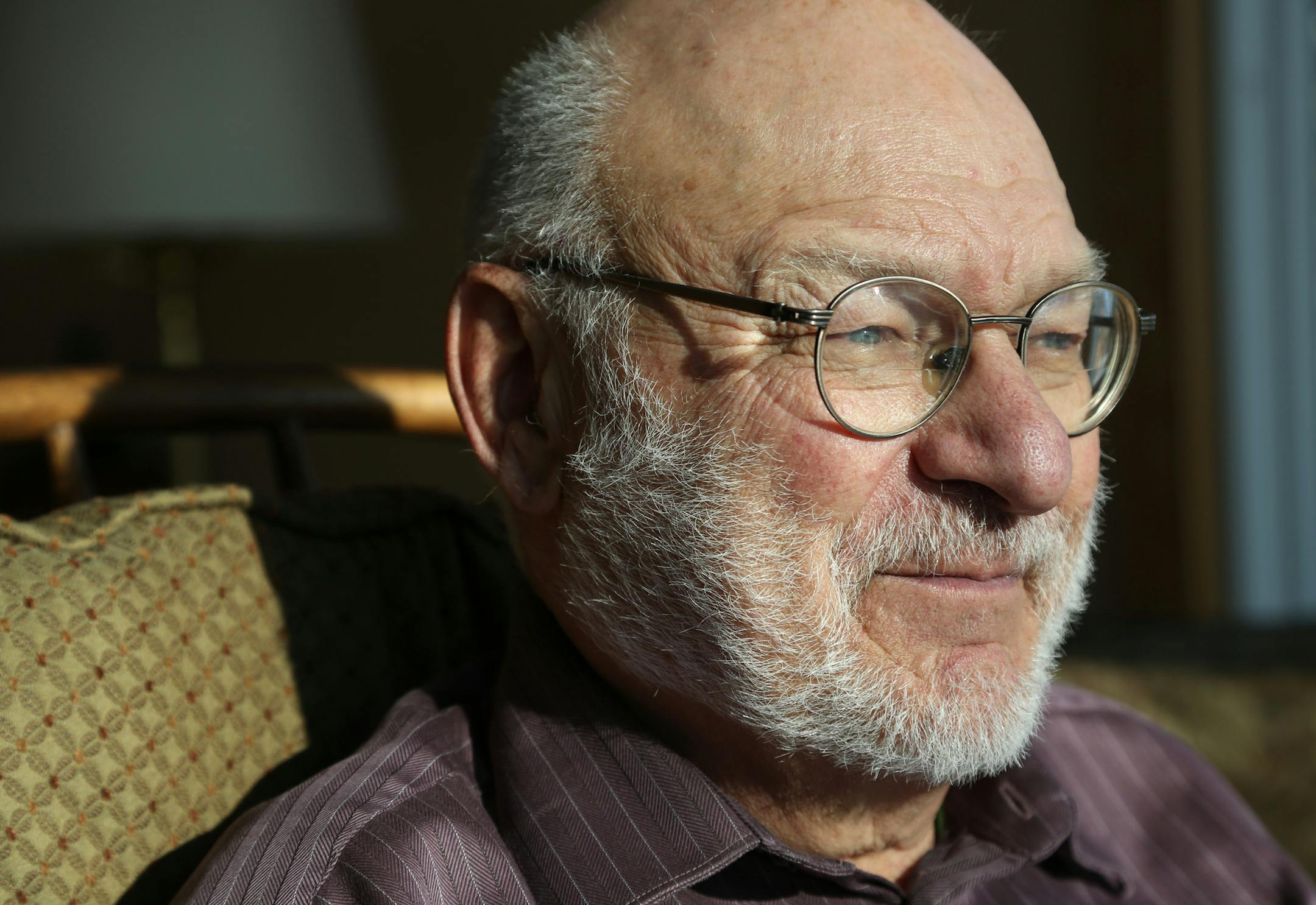 Jerry Bahls sat in his chair where he identified birds in his back yard. Balls was helping find solutions to the Vikings stadium glass and the safety of birds. ] (KYNDELL HARKNESS/STAR TRIBUNE) kyndell.harkness@startribune.com Bahls' home in Fridley, Min., Tuesday, March 3, 2015.