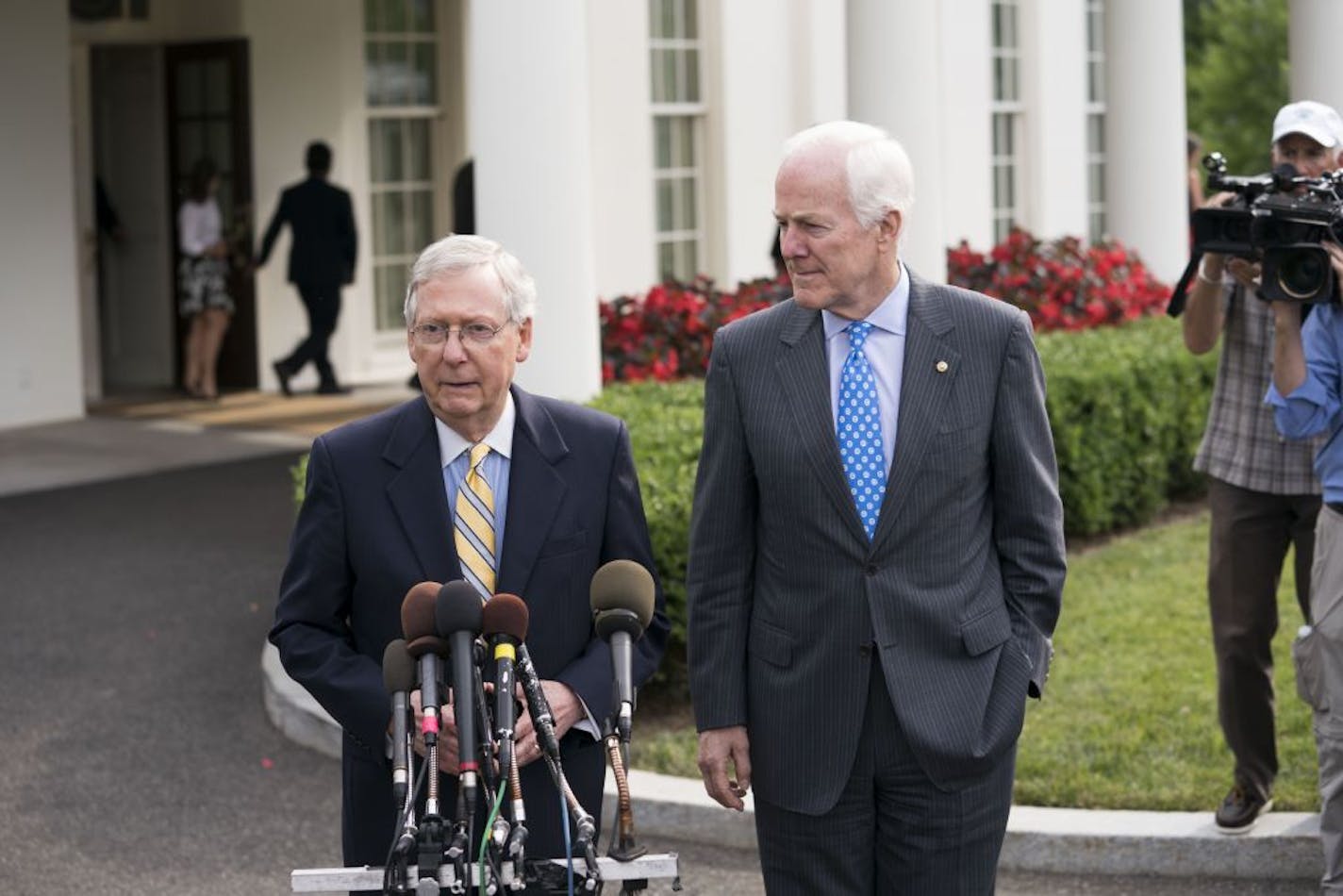 Senate Majority Leader Mitch McConnell (R-Ky.) and Senate Majority Whip John Cornyn (R-Texas) talk with reporters after a meeting with President Donald Trump, at the White House, in Washington, June, 27, 2017. Trump became more engaged Tuesday, summoning all 52 Republican senators to the White House for some last-ditch diplomacy, but only after it became clear Republican leaders were postponing the vote on legislation to repeal the Affordable Care Act until after the Fourth of July recess.